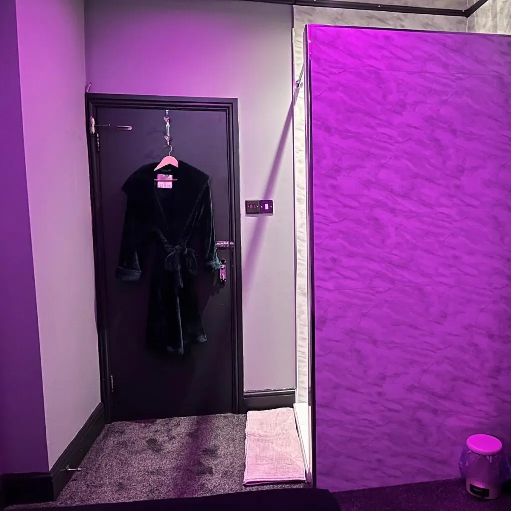 Private guest room entrance with dressing gown at Ladybirds Manchester
