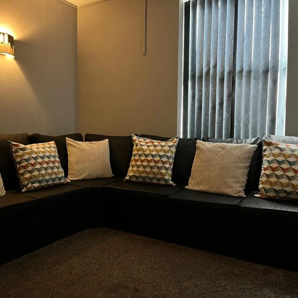 Comfortable reception lounge with corner sofa at Ladybirds Manchester