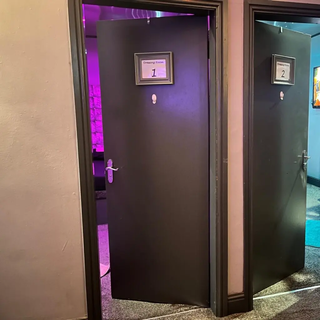 Numbered private guest room doors in the corridor at Ladybirds Manchester