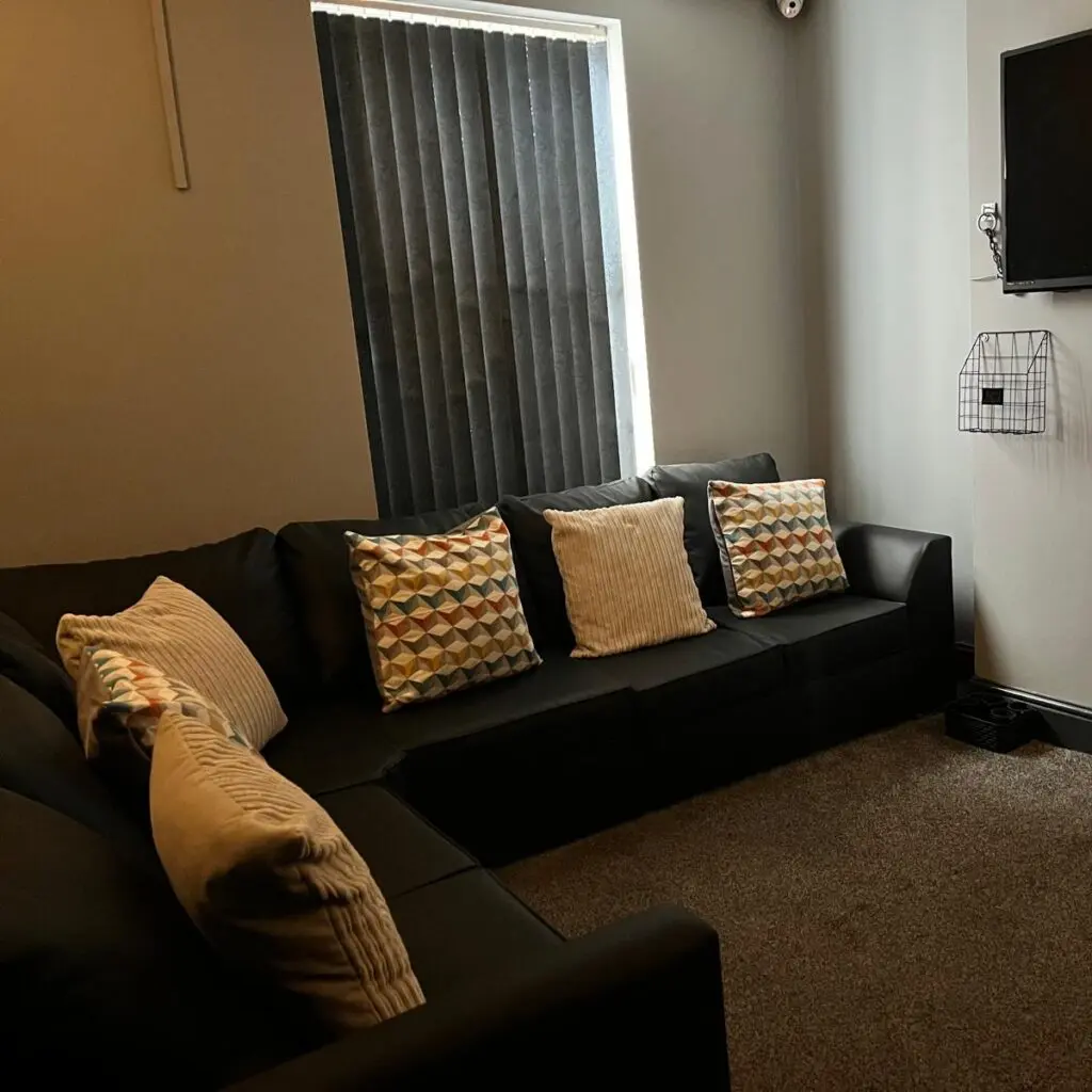 Relaxed lounge seating area at Ladybirds Manchester incall agency